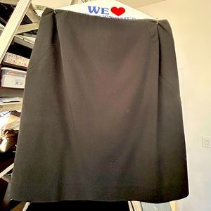 Black pencil skirt (above the knee)